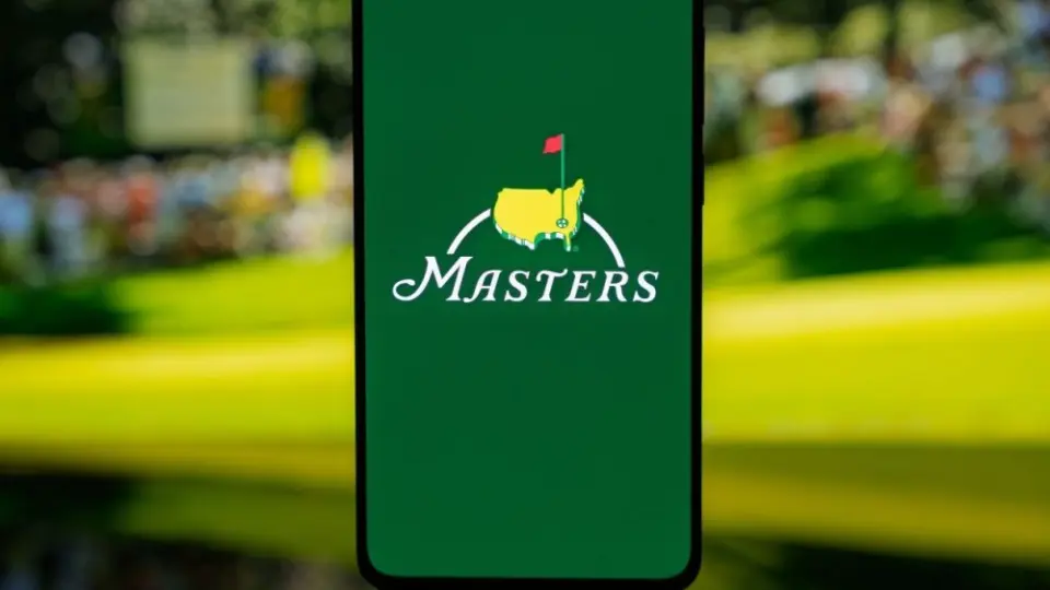 Smartphone displaying The Masters golf tournament logo on a green screen^ set against a blurred background^ representing professional sports media and tournament coverage. Kaunas^ Lithuania - 2026 March 12