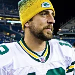 Quarterback Aaron Rodgers walks on Qwest Field after winning a football game August 21^ 2010 in Seattle^ Washington.