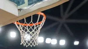 Basketball hoop hanging in a sports stadium waiting for the ball