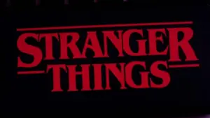 Iphone 11 pro with the Stranger Things logo on top of a computer keyboard. United States^ New York. Sunday^ September 29^ 2019.