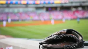 Baseball glove on the wall with a major league stadium in the background