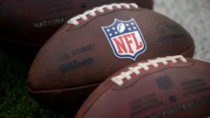 NLF footballs are displayed before an NFL football game between the Los Angeles Rams and the Seattle Seahawks at SoFi Stadium Sunday Nov. 16^ 2025^ in Inglewood^ Calif.
