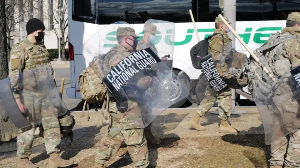 California National Guard troops prepare to board a bus for their return home after completing their assignment in Washington during the inauguration. Washington^ DC – January 22^ 2021