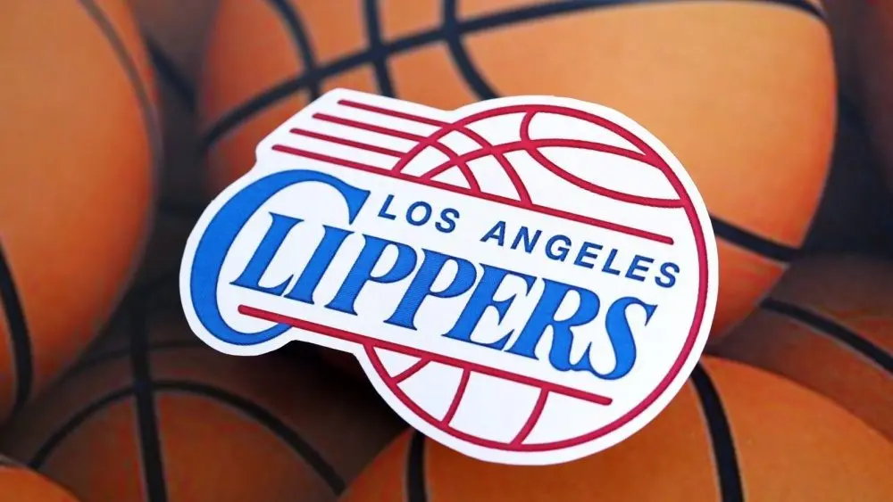 Los Angeles Clippers basketball team badge lies on basketball balls background banner