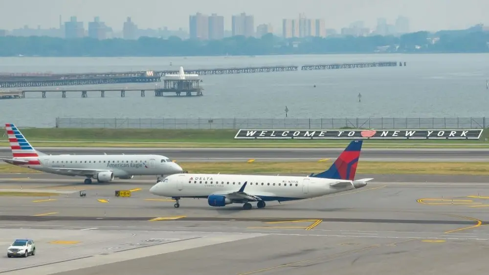 : Delta Airlines and American Eagle planes seen at the runway of LaGuardia International Airport. Manhattan^ New York^ USA - August 5^ 2025