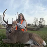 Debbie Statler: This morning I rolled out of bed at 5:45, skipped breakfast, headed to the woods. I sat down in my deer stand at 6:15 and popped open a Diet Coke. As I was enjoying my first sip I glanced to my right and saw antlers. I slowly lowered my Diet Coke and grabbed my gun. The buck was strolling down the hill to my right. I got a look at him through the scope to make sure he was a shooter. On this farm, my husband sets some general standards to ensure deer are given the opportunity to mature. When I saw him clearly, my heart started racing, my whole body started shaking….he qualified. One shot. Down.