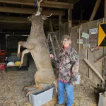 Judy Ringling: I was bow hunting on family property. This is my first kill with a bow. The buck was walking by my stand. I made z noise to make it stop and the rest is history!