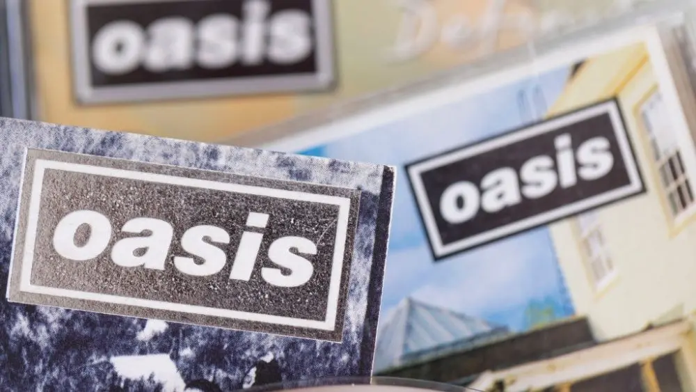 London^ UK - August 27 2024: Oasis band cds. Oasis are a popular rock band from the 1990's britpop era