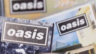 London^ UK - August 27 2024: Oasis band cds. Oasis are a popular rock band from the 1990's britpop era