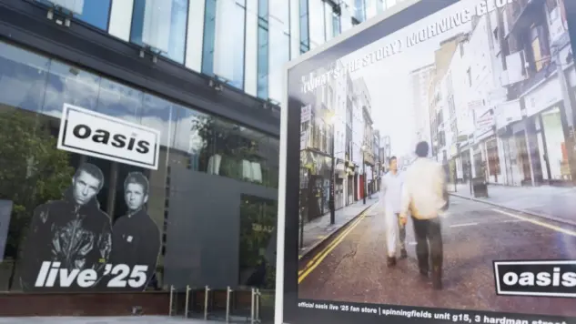 Oasis album cover artwork on display outside the Oasis live 25 shop in Manchester Manchester^ UK - 26 June 2025