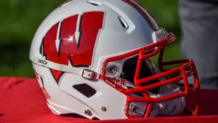 Chicago^ IL September 25^ 2021^ University of Wisconsin Badgers college football helmet^ red and white^ W logo^ American Football^ Big Ten