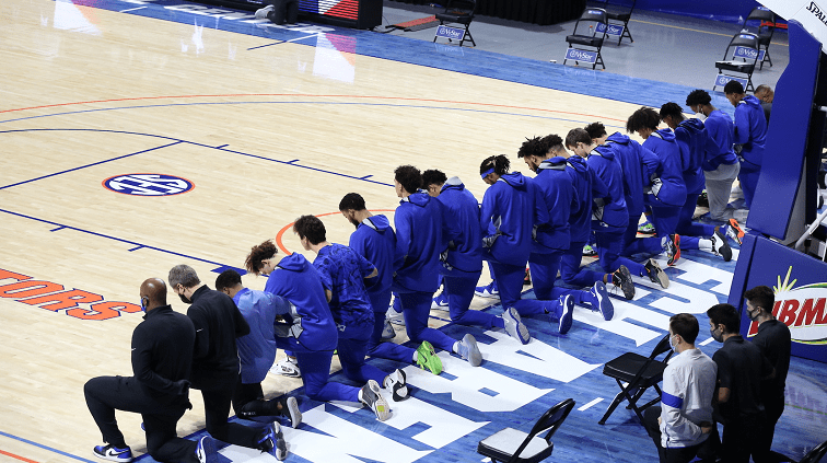 NBA players and coaches kneel during national anthem as season
