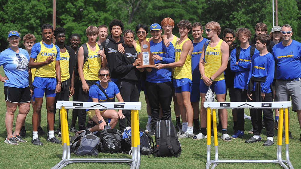 caldwell-with-trophy-at-regional-track