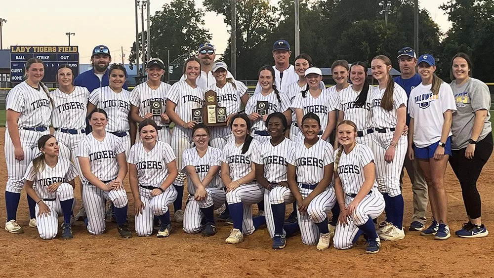 lady-tigers-with-district-championship-trophy