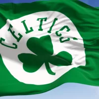 Boston Celtics flag waving in the wind on a clear day. American professional basketball team^ Eastern Conference Atlantic Division. Illustrative editorial 3d illustration render