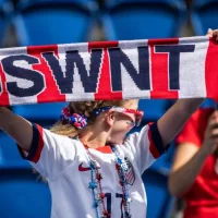 A fan holds USWNT scarf before the 2019 FIFA Women's World Cup match between USA and Chile.