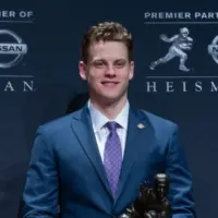 Quarterback Joe Burrow of the LSU Tigers winner of the 85th annual Heisman Memorial Trophy poses with trophy at the Marriott Marquis Hotel New York^ NY - December 14^ 2019