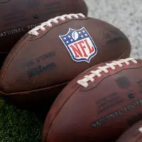 NLF footballs are displayed before an NFL football game between the Los Angeles Rams and the Seattle Seahawks at SoFi Stadium Sunday Nov. 16^ 2025^ in Inglewood^ Calif.