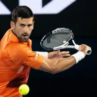 Novak Djokovic of Serbia hits a shot to Nick Kyrgios of Australia in an Arena Showdown charity match ahead of the 2023 Australian Open at Melbourne Park MELBOURNE^ AUSTRALIA - JANUARY 13