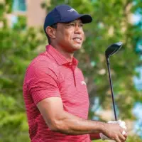 Tiger Woods watches his tee shot off the 10th hole during the final round of the PNC Championship at the Ritz-Carlton Golf Club on December 22^ 2024.