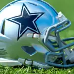 NFL Dallas Cowboys replica helmet on artificial grass playing turf ^ product shot