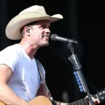 Dustin Lynch performs during the 'Kick The Dust Up' Tour at Vanderbilt Stadium on July 11^ 2015 in Nashville^ Tennessee.