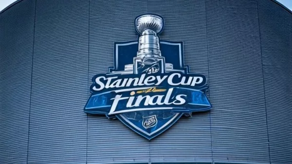 the front facade of a hockey arena with the NHL Stanley Cup Finals logo on the front of the building.