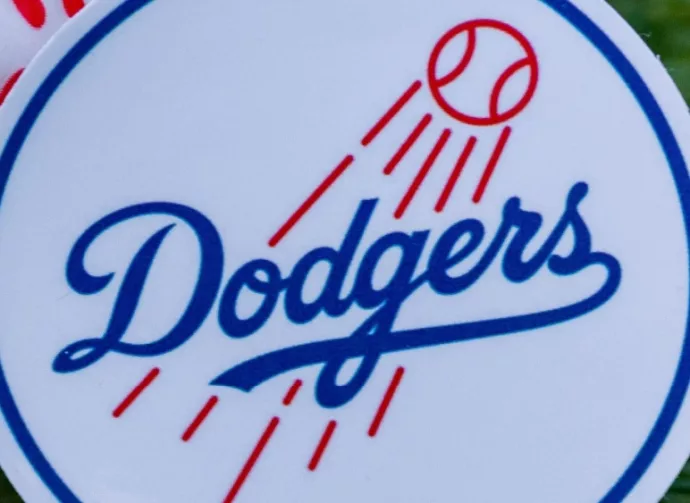 The emblem of the Los Angeles Dodgers baseball club and a baseball. September 26^ 2022^ Cooperstown^ New York