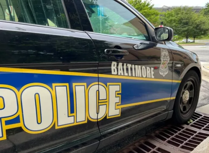 BALTIMORE^ MARYLAND - JULY 29^ 2023: Baltimore Maryland police department sign on police cruiser