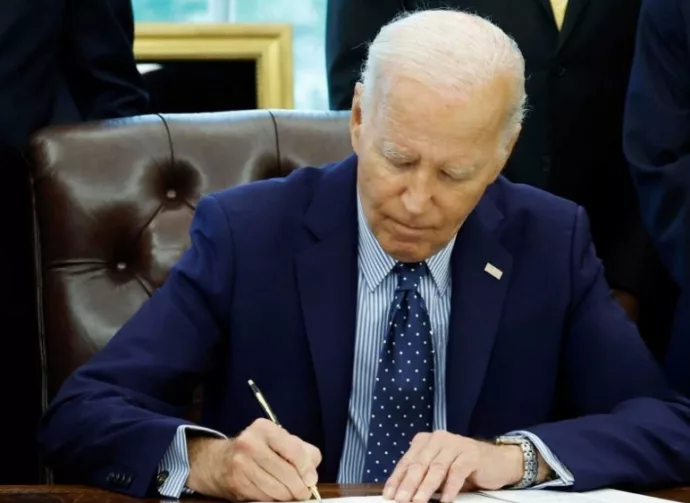 U.S. President Joe Biden signs a proclamation in the Oval Office of the White House. WASHINGTON^ DC - AUGUST 16