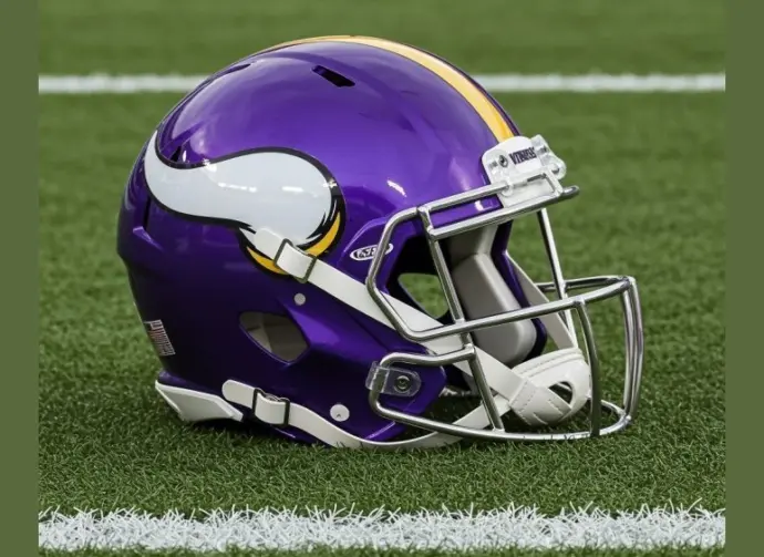 NFL's Minnesota Vikings helmet placed on football field - AI GENERATED IMAGE