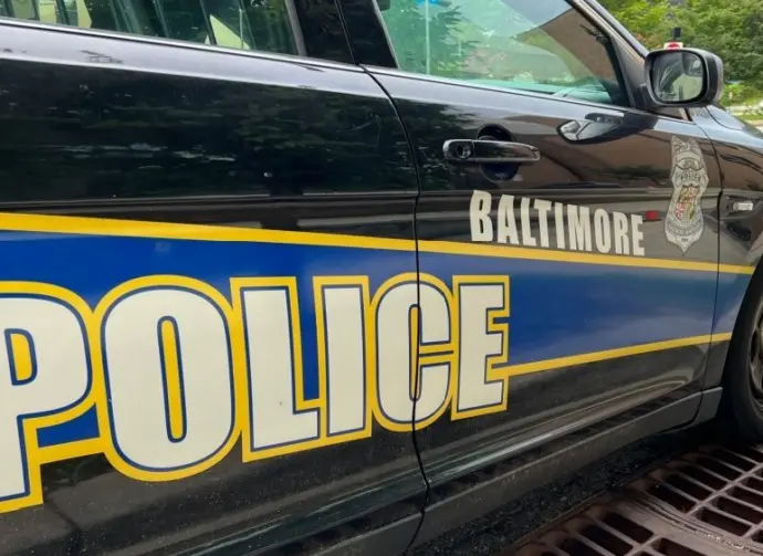 Baltimore Maryland police department sign on police cruiser BALTIMORE^ MARYLAND - JULY 29^ 2023
