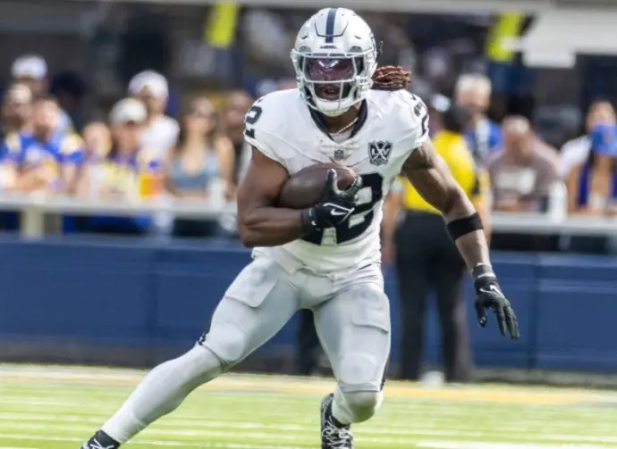 Las Vegas Raiders running back Alexander Mattison #22 runs the ball against the Los Angeles Rams in an NFL football game at SoFi Stadium^ Oct. 20^ 2024^ in Inglewood^ Calif.