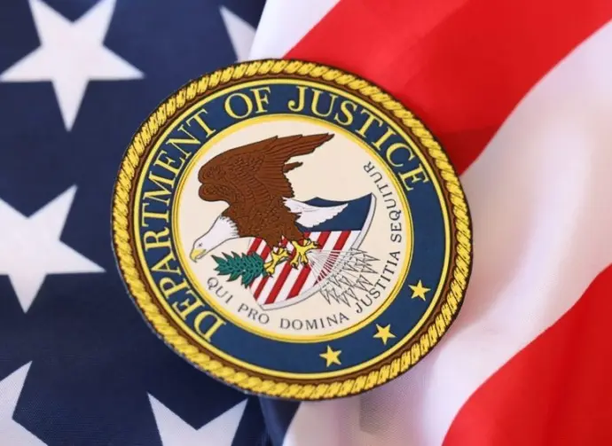 US Department of Justice seal on United States of America flag close up
