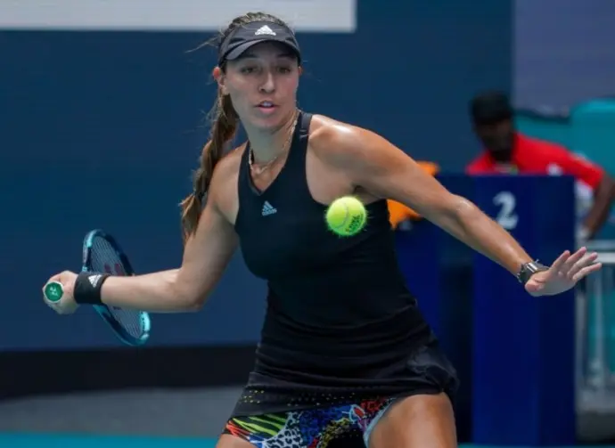 Professional tennis player Jessica Pegula of USA in action during Miami Open 2022 quarter-final match at the Hard Rock Stadium in Miami Gardens^ Florida MIAMI GARDENS^ FLORIDA - MARCH 30^ 2022