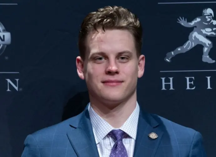 Quarterback Joe Burrow of the LSU Tigers winner of the 85th annual Heisman Memorial Trophy poses with trophy at the Marriott Marquis Hotel New York^ NY - December 14^ 2019