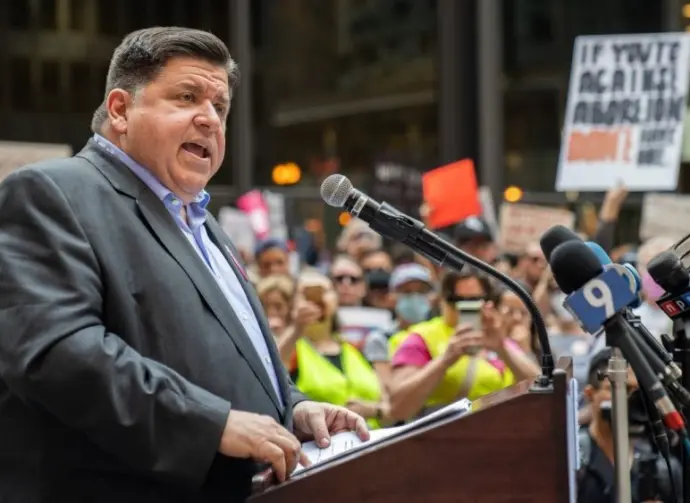 Protests in downtown Chicago after overturning of Roe v. Wade^ Governor of Illinois^ J. B. Pritzker^ talking to protester in support Chicago^ Illinois - June 24 2022