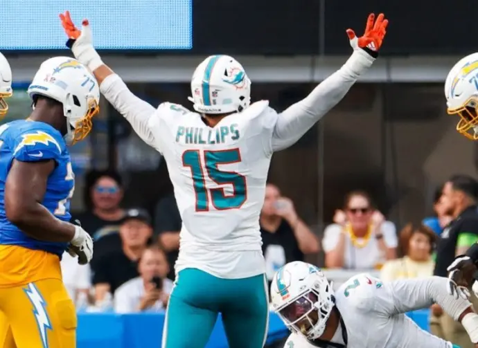 Miami Dolphins linebacker Jaelan Phillips (15) celebrates after an interception against the Los Angeles Chargers during an NFL football game^ Sept. 10^ 2023^ in Inglewood^ Calif.