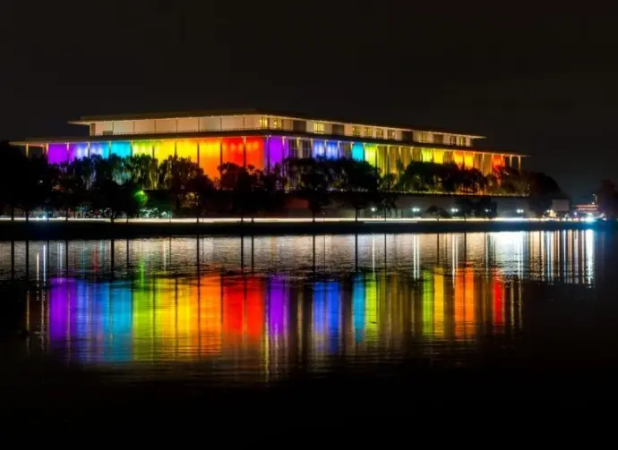 The Kennedy Center illuminated in a rainbow of colors in recognition of the upcoming Kennedy Center Honors. Washington^ DC / USA - November 19^ 2019
