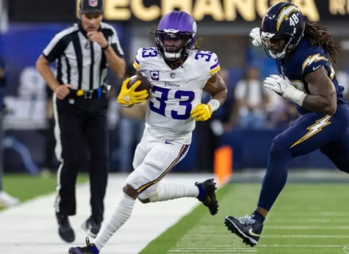 Minnesota Vikings running back Aaron Jones in runs against the Los Angeles Chargers during an NFL football game Oct. 23^ 2025^ in Inglewood^ Calif.
