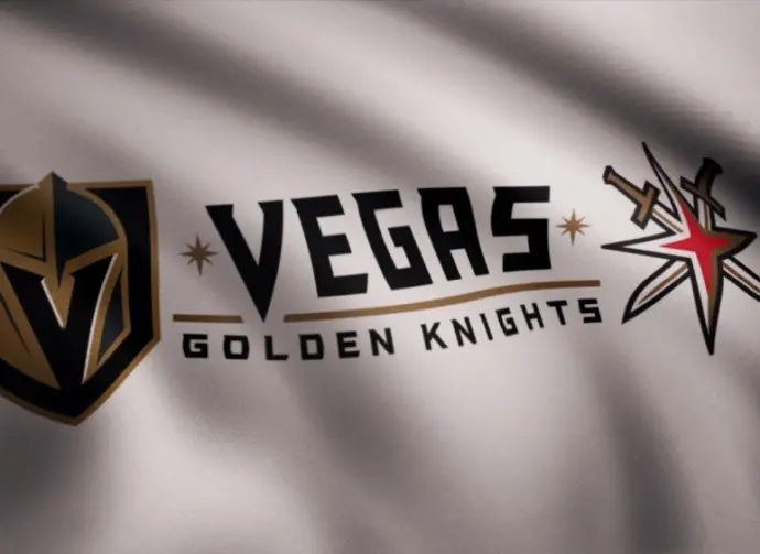 Waving flag with Vegas Golden Knights NHL hockey team logo. Close-up of waving flag with Vegas Golden Knights NHL hockey team logo^ seamless loop. Editorial footage