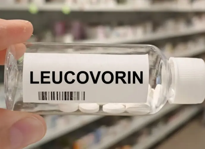 Bottle of LEUCOVORIN tablets on a hospital pharmacy table used to reduce methotrexate toxicity a folinic acid supplement.