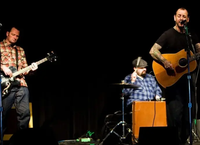 Mike Ness of rock band Social Distortion sings and plays guitar on stage at the Crocodile in Seattle on February 13^ 2011.