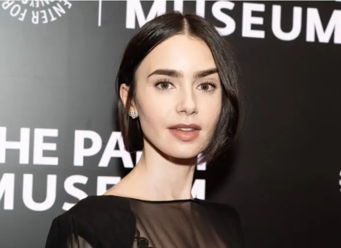 Lily Collins wearing dress and shoes by Versace attends PaleyLive program: Emily in Paris: The Magic Behind the Scenes at Paley Center for MEdia in New York on September 17^ 2024