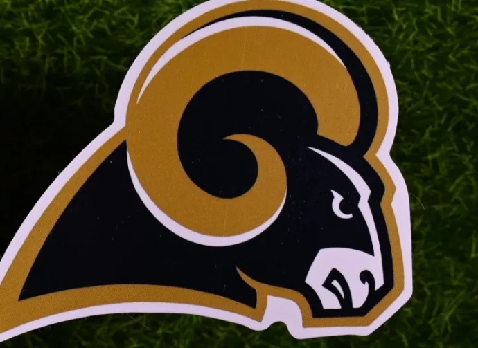 The logo of the Los Angeles Rams football club on the green lawn of the stadium.