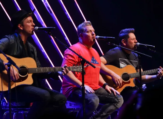 Joe Don Rooney^ Gary LeVox and Jay DeMarcus (L-R) of Rascal Flatts perform at CBS Radio's Stars & Stripes event at the Chicago Theatre on November 9^ 2016 in Chicago^ Illinois.