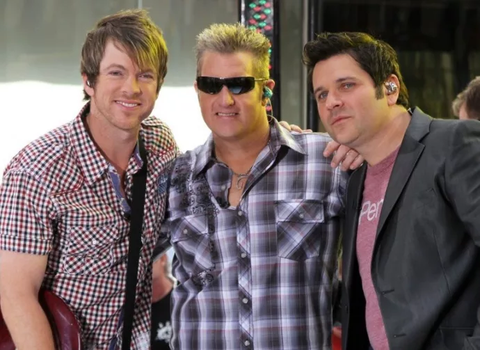Guitarist Joe Don Rooney^ singer Gary Levox and bassist Jay DeMarcus of Rascal Flatts perform on NBC's Today Show in Rockefeller Plaza on June 11^ 2010 in New York City.