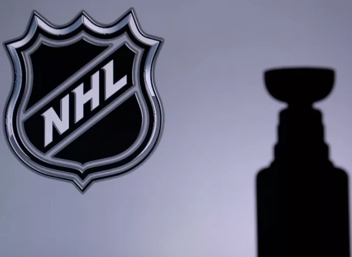 National Hockey LeagueLogo of NHL club on the screen. Stenley Cup Trophy Silhouette.