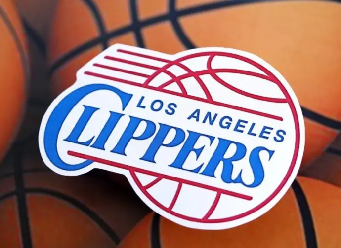 Los Angeles Clippers basketball team badge lies on basketball balls background banner