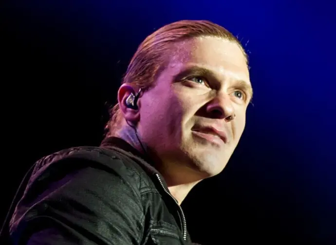 Brent Smith of Shinedown against a black and blue background at Rockstar Uproar Festival on September 25 2012 in Nampa^ Idaho.